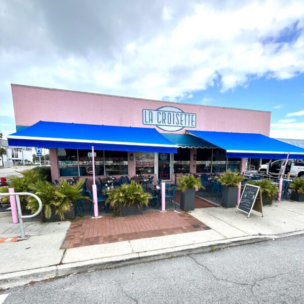 Custom blue fabric commercial awnings installed at La Croisette restaurant by Cover Up Awning in the Tampa Bay area